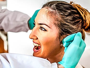 dentist providing patient with a digital smile design consultation