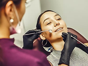 woman receiving a dental cleaning
