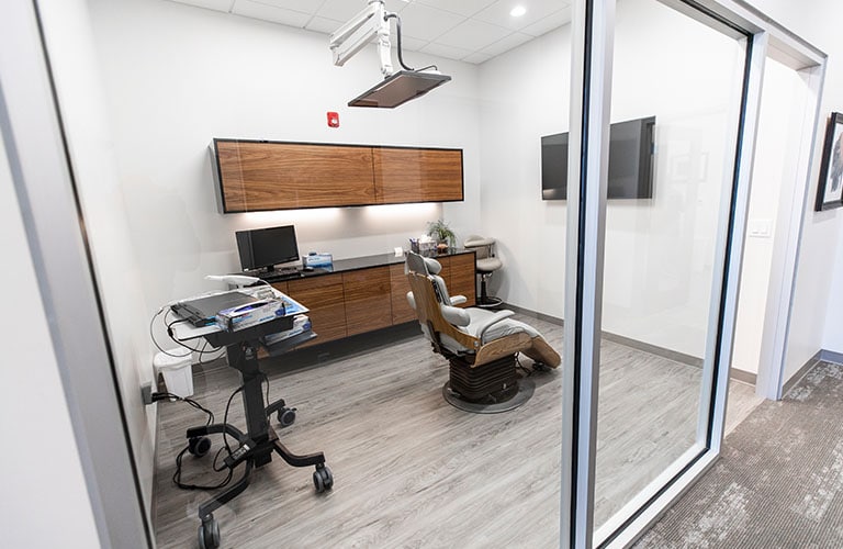 modern dental treatment room at arete smile design center